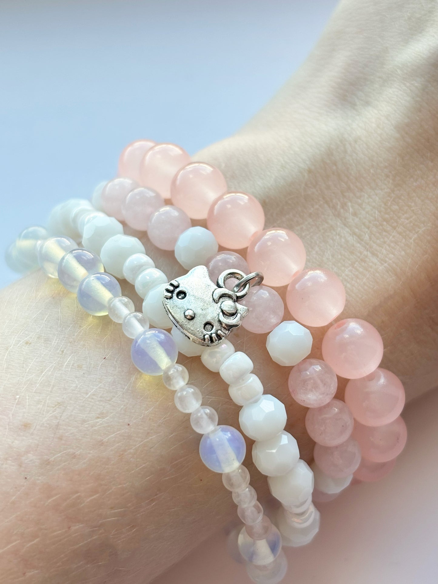 Pink kitty bracelet stack